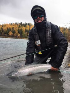 Frank Smethurst in rain gear with Steelhead